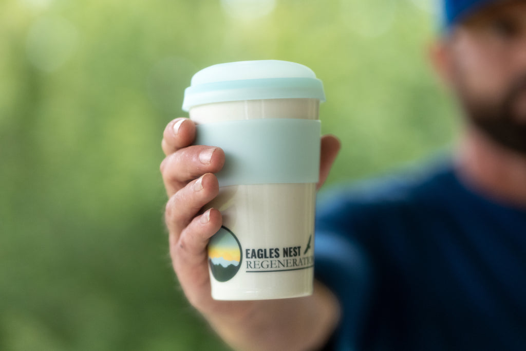 enr-travel-mug-floyd-mug-company-held-in-hand