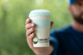 enr-travel-mug-floyd-mug-company-held-in-hand